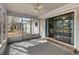 Enclosed sunroom with screened windows and a sliding glass door leading inside the home at 614 Cavandish Dr., Myrtle Beach, SC 29588