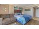Cozy bedroom with a large bed, couch, and decorative wall art at 6900 N Ocean Blvd. # 513, Myrtle Beach, SC 29572