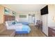 Comfortable bedroom with a bed, couch, TV, and kitchenette at 6900 N Ocean Blvd. # 513, Myrtle Beach, SC 29572