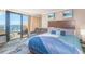 Inviting bedroom offering a cozy seating area and breathtaking ocean views from the balcony at 6900 N Ocean Blvd. # 513, Myrtle Beach, SC 29572