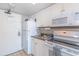 Functional kitchen equipped with essential appliances, including a refrigerator, microwave, and stove at 6900 N Ocean Blvd. # 513, Myrtle Beach, SC 29572
