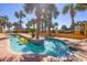 Beautiful lazy river lined with palm trees, offering a relaxing amenity for residents and guests at 6900 N Ocean Blvd. # 513, Myrtle Beach, SC 29572