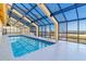 Indoor pool with large windows providing beautiful views and natural light at 6900 N Ocean Blvd. # 513, Myrtle Beach, SC 29572