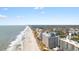 Wide aerial shot highlighting beachfront condos with stunning ocean and wooded views at 7100 N Ocean Blvd. # 221, Myrtle Beach, SC 29572