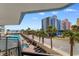 Scenic balcony view overlooking a pool, palm trees, and the ocean at 7100 N Ocean Blvd. # 221, Myrtle Beach, SC 29572