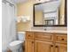 Well-maintained bathroom featuring a vanity, mirror, and shower with curtains at 7100 N Ocean Blvd. # 221, Myrtle Beach, SC 29572