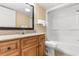 Well-appointed bathroom with granite countertops, a large mirror, and a tub with shower combination at 7100 N Ocean Blvd. # 221, Myrtle Beach, SC 29572
