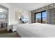Bright bedroom featuring a balcony, modern furniture, and a view of the outside at 7100 N Ocean Blvd. # 221, Myrtle Beach, SC 29572