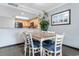 Cozy dining area with seating for six adjacent to the kitchen featuring updated appliances and a breakfast bar at 7100 N Ocean Blvd. # 221, Myrtle Beach, SC 29572