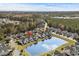 Stunning aerial view of a townhouse community with a pond and fountain in a lush green landscape and views to the ocean at 712 Painted Bunting Dr. # B, Murrells Inlet, SC 29576