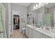 Spacious bathroom featuring double sinks, a walk-in closet, and modern finishes at 712 Painted Bunting Dr. # B, Murrells Inlet, SC 29576