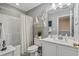 Bright bathroom with a tub/shower combination, white vanity, and nautical decor at 712 Painted Bunting Dr. # B, Murrells Inlet, SC 29576