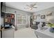 Well-lit bedroom or office with built-in bookshelves, a window, and a cozy sitting area at 712 Painted Bunting Dr. # B, Murrells Inlet, SC 29576