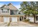 Charming townhome with brick accents, attached garage, and manicured landscaping under a sunny blue sky at 712 Painted Bunting Dr. # B, Murrells Inlet, SC 29576