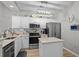 Charming kitchen featuring white cabinets, stainless steel appliances, and a convenient island at 712 Painted Bunting Dr. # B, Murrells Inlet, SC 29576
