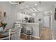 Bright kitchen with white cabinetry, stainless steel appliances, and a breakfast bar with seating at 712 Painted Bunting Dr. # B, Murrells Inlet, SC 29576