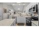 Bright kitchen with stainless appliances, a center island, and an open floor plan at 712 Painted Bunting Dr. # B, Murrells Inlet, SC 29576
