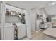 Efficient laundry area with washer, dryer, and storage shelves for added convenience at 712 Painted Bunting Dr. # B, Murrells Inlet, SC 29576