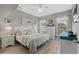 Serene bedroom with a plush bed, soft lighting, and coordinated décor; ample natural light from two windows at 712 Painted Bunting Dr. # B, Murrells Inlet, SC 29576