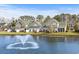Scenic water view of townhomes from fountain, offering a relaxing and picturesque community setting at 712 Painted Bunting Dr. # B, Murrells Inlet, SC 29576