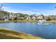 Beautiful water view of townhomes and fountain, showcasing a tranquil community setting at 712 Painted Bunting Dr. # B, Murrells Inlet, SC 29576