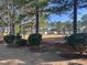 Scenic view of the well-maintained backyard bordering a lush green landscape at 7471 Balmore Dr. Sw, Sunset Beach, NC 28468