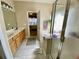 Bathroom featuring a double vanity, soaking tub, and separate glass enclosed shower at 7471 Balmore Dr. Sw, Sunset Beach, NC 28468