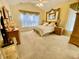 Spacious bedroom features a ceiling fan, vaulted ceiling, and natural light from the window at 7471 Balmore Dr. Sw, Sunset Beach, NC 28468