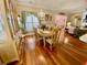 Charming dining room with hardwood floors, elegant chandelier, and a large window at 7471 Balmore Dr. Sw, Sunset Beach, NC 28468