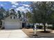 Inviting home exterior featuring a well-manicured lawn and a charming mailbox at 7471 Balmore Dr. Sw, Sunset Beach, NC 28468