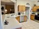 Bright kitchen featuring stainless steel appliances, light-colored countertops, and wood cabinets at 7471 Balmore Dr. Sw, Sunset Beach, NC 28468