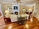 Bright and airy living room showcasing hardwood floors, a fireplace, and comfortable seating at 7471 Balmore Dr. Sw, Sunset Beach, NC 28468