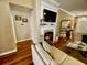 Inviting living room with a fireplace, mounted television, and hardwood floors at 7471 Balmore Dr. Sw, Sunset Beach, NC 28468