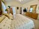 Relaxing main bedroom with carpet, high ceilings, and ensuite bathroom at 7471 Balmore Dr. Sw, Sunset Beach, NC 28468