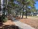 Scenic path winds through trees on the golf course at 7471 Balmore Dr. Sw, Sunset Beach, NC 28468