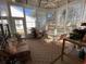 Bright sunroom boasts lots of windows and cozy seating area at 7471 Balmore Dr. Sw, Sunset Beach, NC 28468