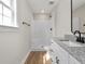 Bathroom featuring a shower, toilet, sink and granite countertops at 813 Highway 67, Loris, SC 29569