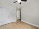 This bedroom features wood-look flooring, a ceiling fan, and a closet at 813 Highway 67, Loris, SC 29569