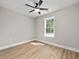 This room features an installed ceiling fan, window, and new vinyl flooring at 813 Highway 67, Loris, SC 29569