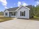 Attractive one-story home with blue siding and a concrete driveway at 813 Highway 67, Loris, SC 29569