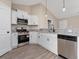 This open kitchen features stainless steel appliances and granite countertops at 813 Highway 67, Loris, SC 29569