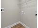 A laundry room with a shelf, outlets, and new vinyl flooring at 813 Highway 67, Loris, SC 29569