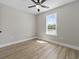 A bright bedroom with a window and ceiling fan at 825 Highway 67, Loris, SC 29569