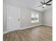 An entryway featuring light gray walls, faux wood flooring, white trim, and a ceiling fan at 825 Highway 67, Loris, SC 29569