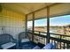 Relaxing screened-in balcony providing seating and views of the waterfront landscape at 9501 Shore Dr. # D-337, Myrtle Beach, SC 29572