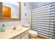 Bright bathroom with a vanity, toilet, framed mirror, and shower-tub combo at 9501 Shore Dr. # D-337, Myrtle Beach, SC 29572