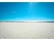 Expansive white sandy beach with a view of the ocean and pier under a clear blue sky at 9501 Shore Dr. # D-337, Myrtle Beach, SC 29572