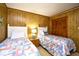 Comfortable bedroom showcasing twin beds, a nightstand, and a closet with wooden doors at 9501 Shore Dr. # D-337, Myrtle Beach, SC 29572