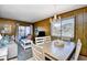 Cozy living and dining area featuring ample seating, natural light, and access to outdoor balcony at 9501 Shore Dr. # D-337, Myrtle Beach, SC 29572