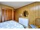 Comfortable bedroom with bright accents, closet, and a vanity at 9501 Shore Dr. # D-337, Myrtle Beach, SC 29572